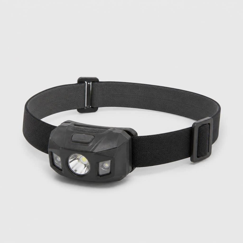 Petite lampe frontale simple posée sur fond clair